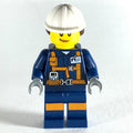 fig-008289 – Miner, Woman, Dark Blue Jacket with Straps and ID Badge, White Hard Hat with Hair, Smirk