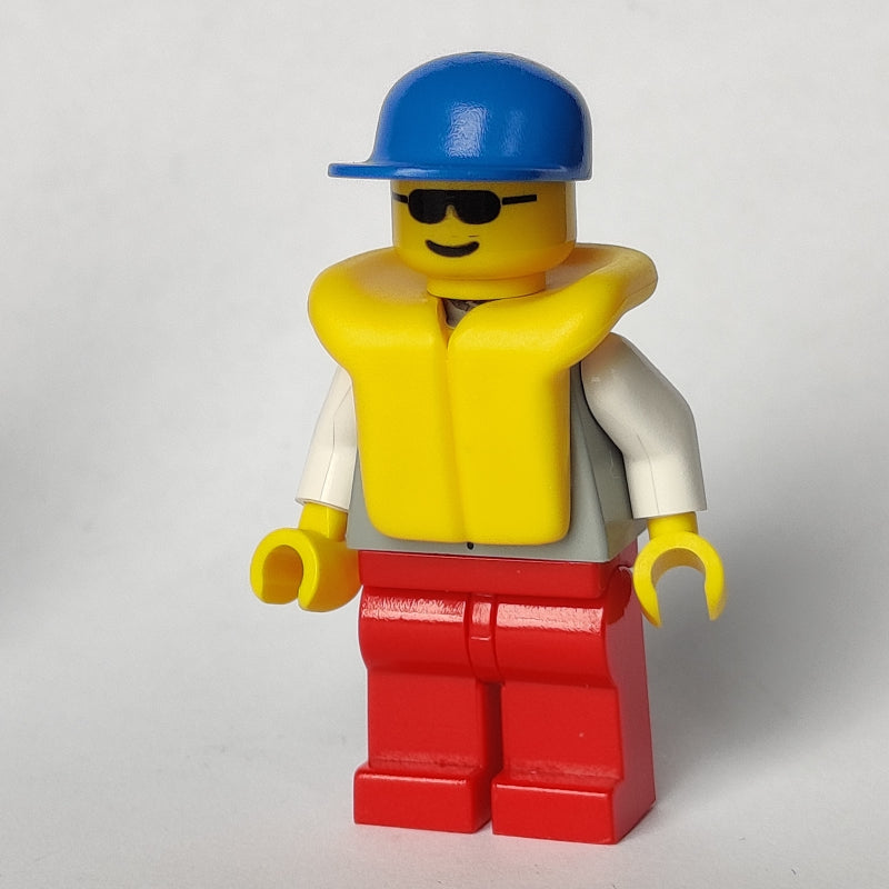 fig-008307 – Light Grey Jacket, Red Legs, Blue Cap, Sunglasses