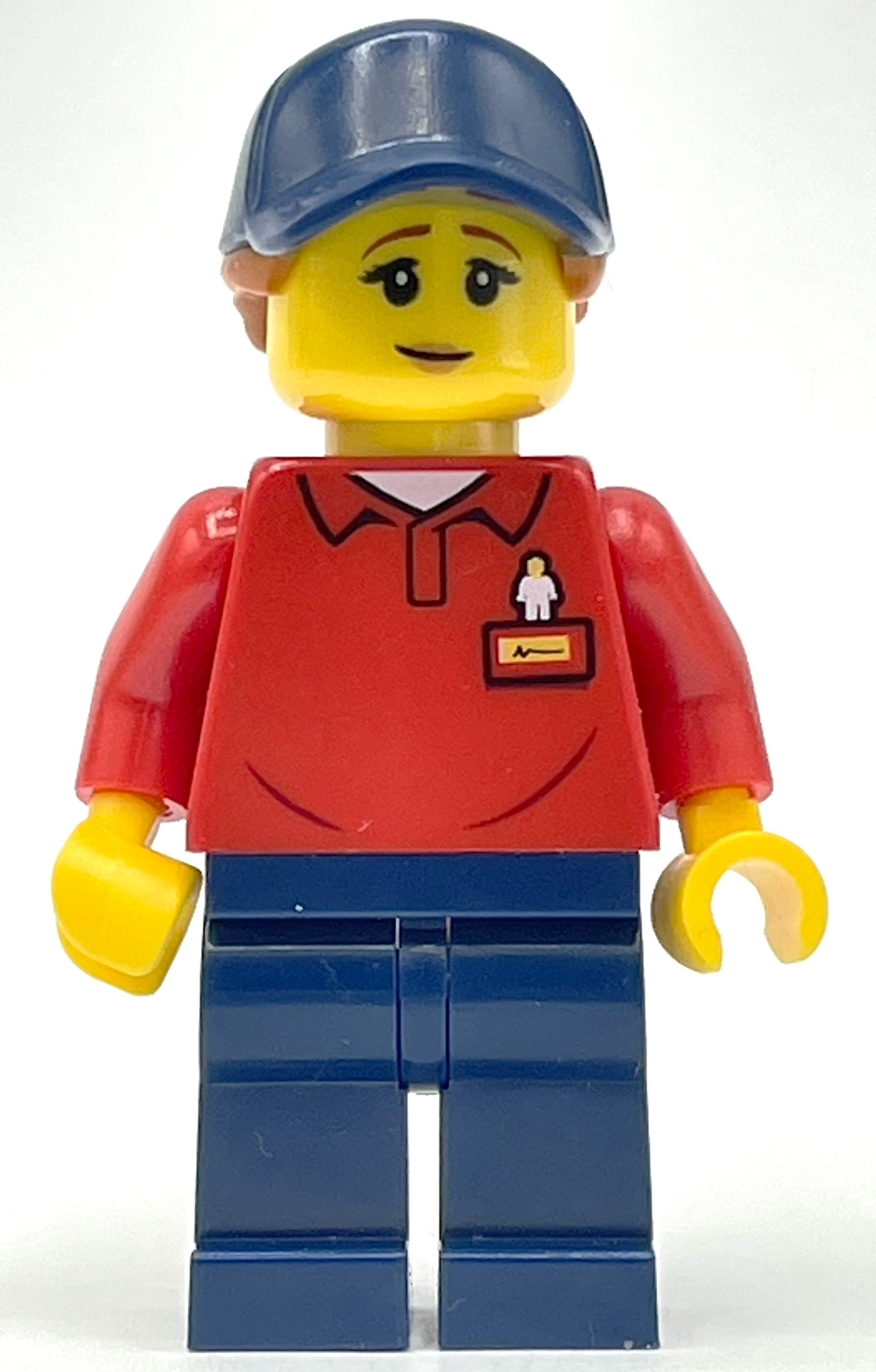 fig-008447 – LEGOLAND Employee, Red Torso, Dark Blue Legs, Dark Blue Cap, Reddish Brown Hair