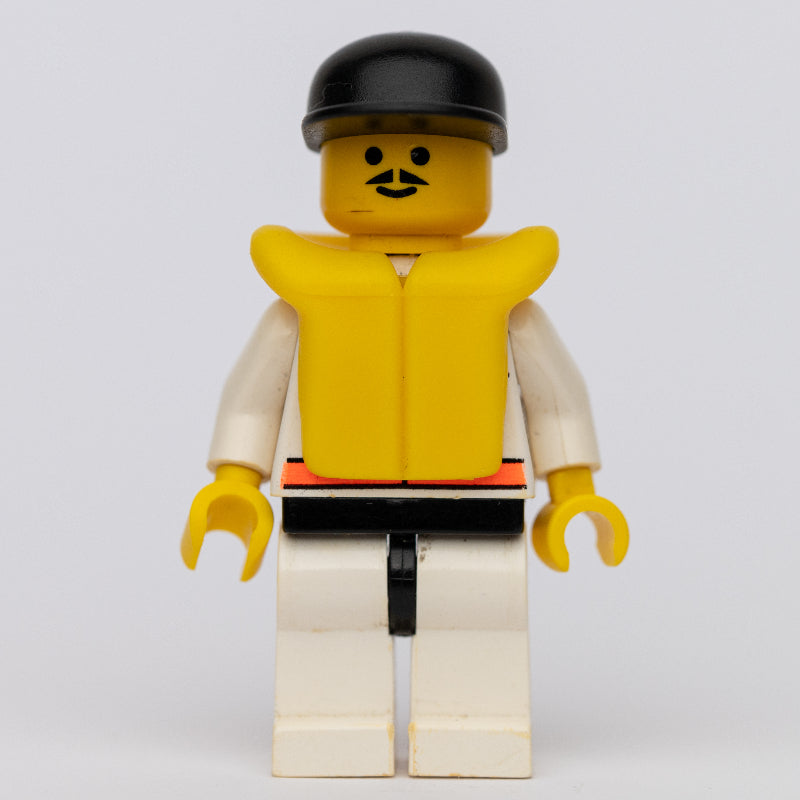 fig-008534 – Res-Q Man, Black Cap, Yellow Life Vest, Moustache