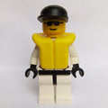 fig-008535 – Res-Q Man, Black Cap, Yellow Life Vest, Sunglasses