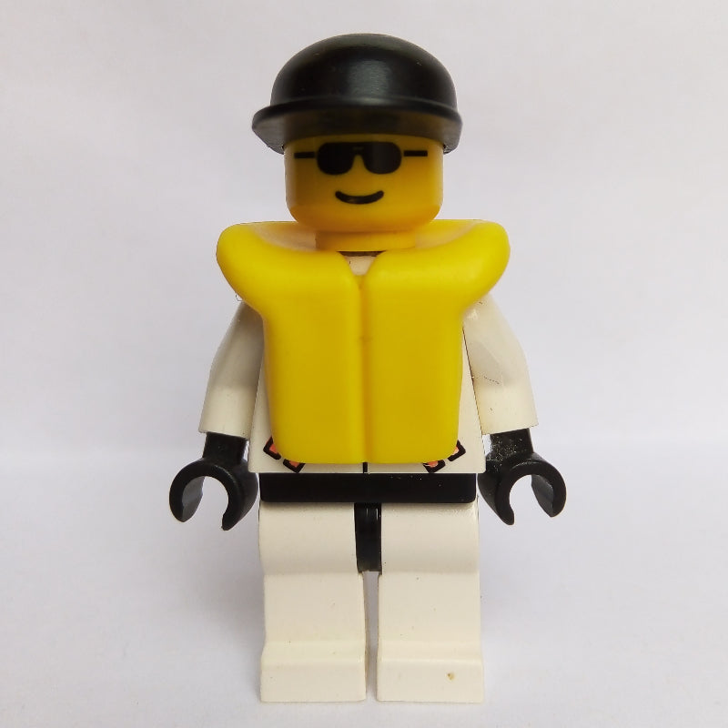 fig-008535 – Res-Q Man, Black Cap, Yellow Life Vest, Sunglasses