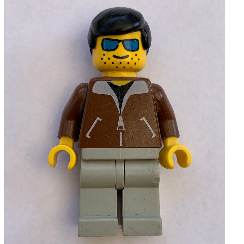 fig-008601 – Man, Brown Jacket, Light Gray Legs, Black Hair, Blue Sunglasses