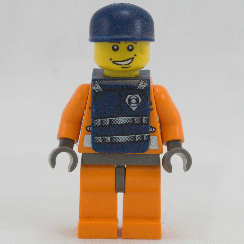 fig-008624 – Coast Guard, Orange Jumpsuit with Zipper, Radio, and Badge, Dark Blue Cap, Dark Blue Vest