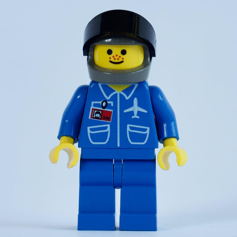 fig-008647 – Pilot, Blue Jacket with Plane Logo and ID Badge, Dark Gray Helmet with Visor