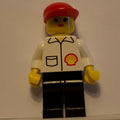 fig-008682 – Woman, White Shirt with Shell Logo, Red Cap