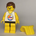 fig-008714 – Man, White Tank Top with Windsurfer, Yellow Legs, Brown Hair, Moustache