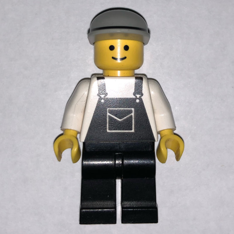 fig-008749 – Man, Black Overalls, Light Gray Cap