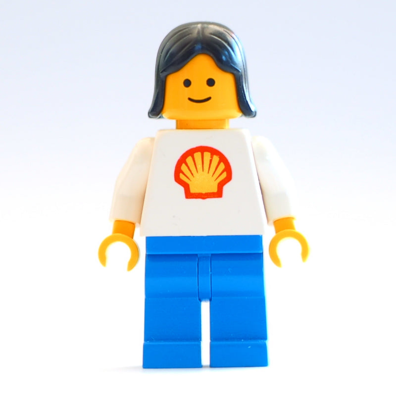 fig-008819 – Woman, White Torso with Shell Logo, Blue Legs, Black Hair