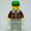 fig-008825 – Man, Brown Jacket, Light Gray Legs, Green Cap, Sunglasses