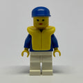 fig-008830 – Woman, Blue and White Jogging Suit, Blue Cap, Yellow Life Vest