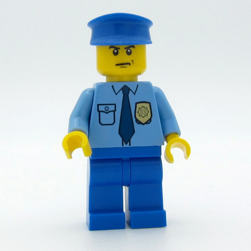 fig-008865 – Policeman, Medium Blue Shirt with Badge and Tie, Blue Legs, Blue Hat, Scowl