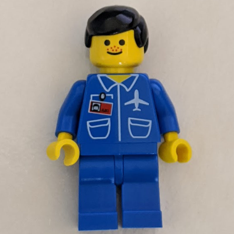 fig-009015 – Ground Crew, Blue Jumpsuit with Plane and ID Badge, Black Hair