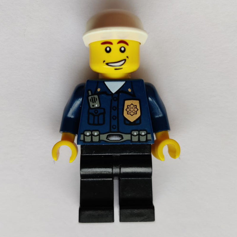 fig-009136 – Policeman, Dark Blue Shirt with Radio and Badge, Black Legs, Black Cap, Smile