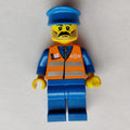 fig-009139 – Train Worker, Orange Safety Vest with Train Logo, Blue Legs, Blue Hat, Moustache