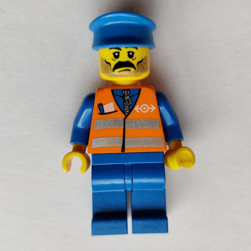 fig-009139 – Train Worker, Orange Safety Vest with Train Logo, Blue Legs, Blue Hat, Moustache