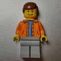 fig-009296 – Man, Open Orange Jacket over Light Blue Shirt, Reddish Brown Hair