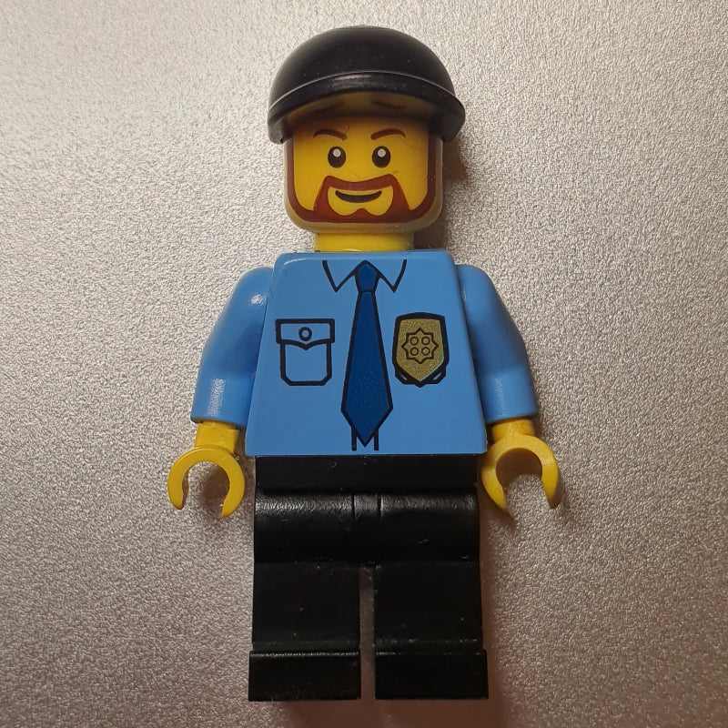 fig-009297 – Policeman, Medium Blue Shirt with Badge and Tie, Black Cap, Beard