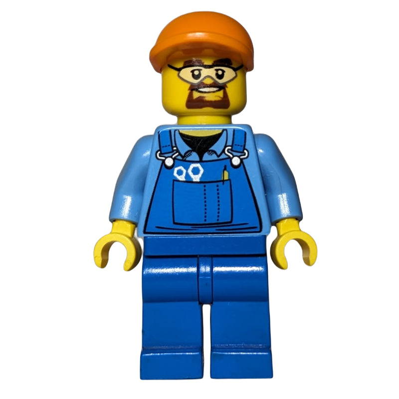 fig-009454 – Man, Blue Overalls over Shirt, Blue Legs, Orange Cap, Safety Glasses and Goatee Beard