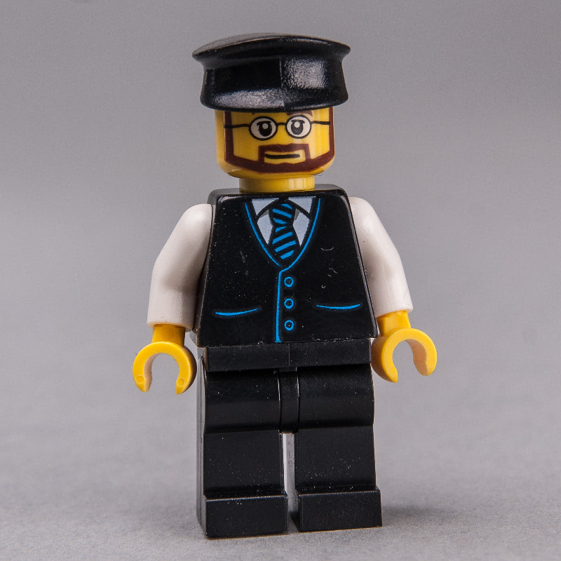 fig-009564 – Man, Black Vest and Tie, Black Legs, Black Hat, Beard and Glasses
