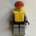 fig-009602 – Lifeguard, Black and Gray Wetsuit, Red Cap, Yellow Life Vest