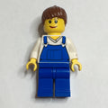fig-009612 – Woman, Blue Overalls over White V-Neck Shirt, Reddish Brown Hair