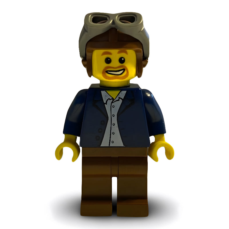 fig-009628 – Man, Open Dark Blue Jacket, Reddish Brown Legs, Helmet and Goggles