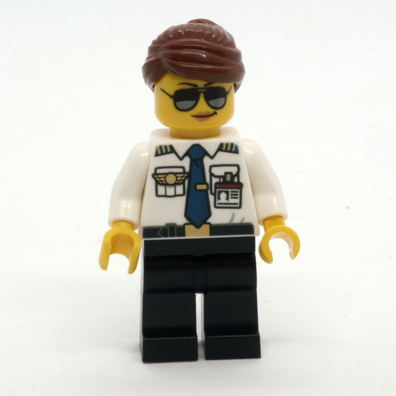 fig-009659 – Pilot, Woman, White Shirt with Tie and Wings Badge, Black Legs, Reddish Brown Hair, Sunglasses