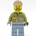fig-009733 – Volcano Explorer, Man, Olive Green Shirt, Sand Blue Legs, Dark Tan Cap, Beard