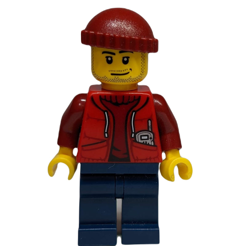 fig-009752 – Marine Explorer, Open Red Jacket over Dark Red Sweater, Dark Red Hat, Stubble