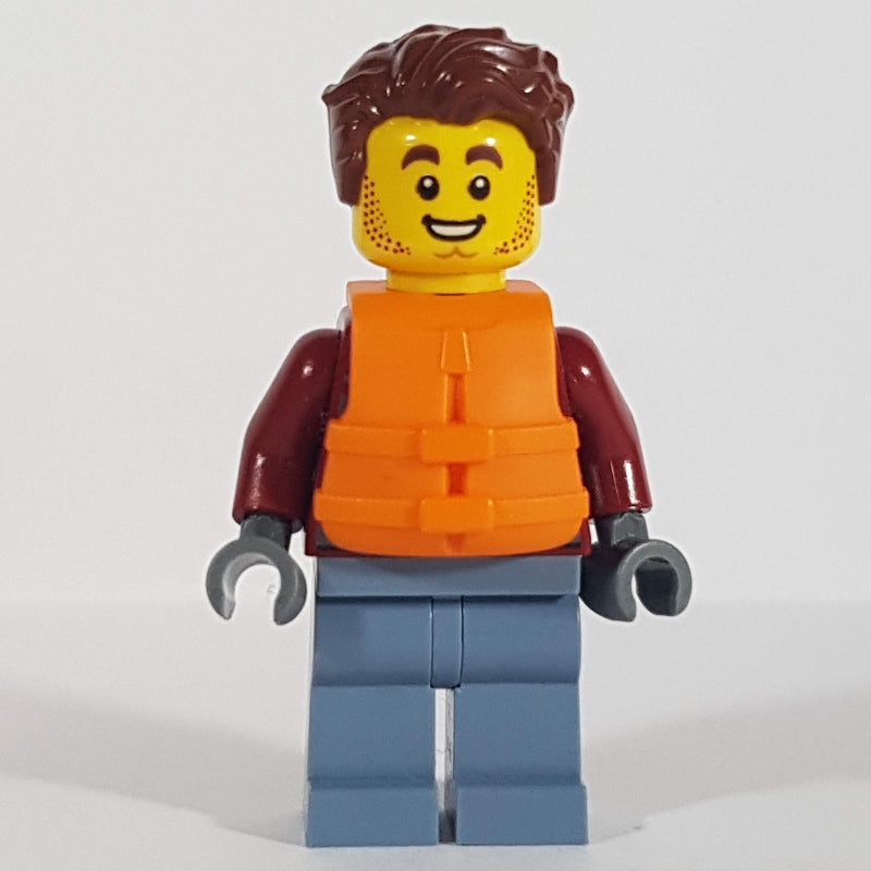 fig-009758 – Harl Hubbs, Dark Red Jacket, Sand Blue Legs, Reddish Brown Hair, Orange Life Vest