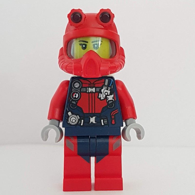 fig-009763 – Diver, Woman, Red and Dark Blue Wetsuit with Straps and Gauges, Red Diving Helmet, Airtanks