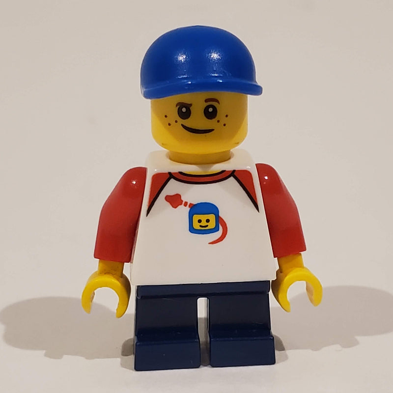 fig-009779 – Boy, Classic Spaceman on Shirt, Short Dark Blue Legs, Blue Cap