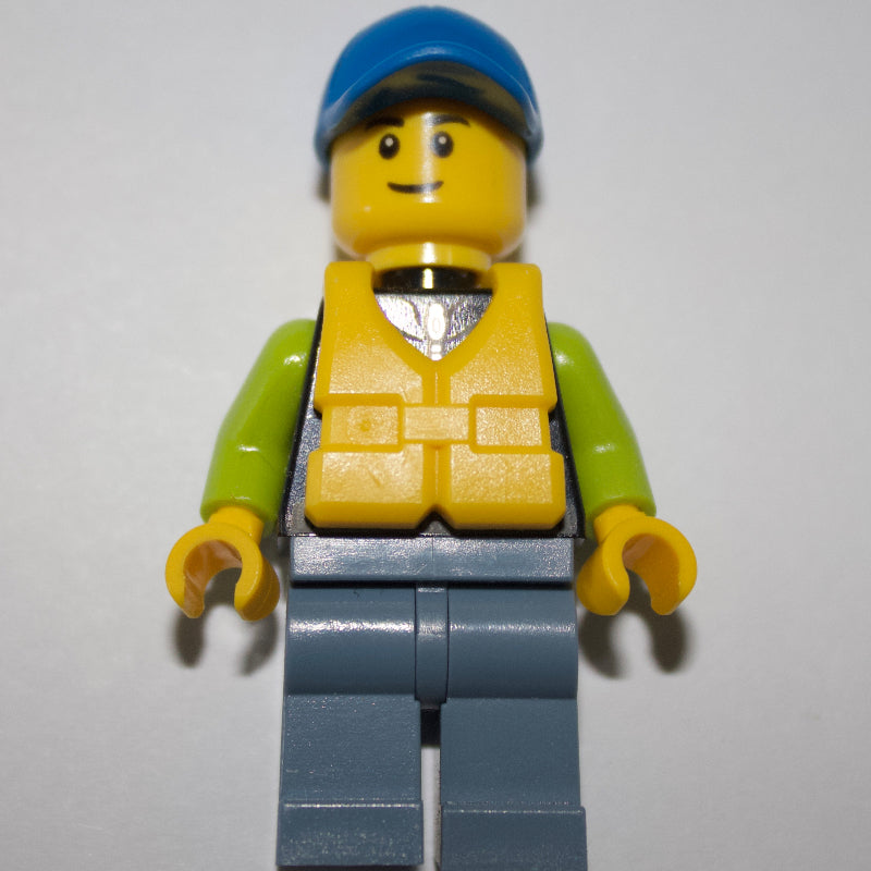 fig-009809 – Man, Black and Lime Jacket, Blue Cap, Yellow Life Vest