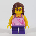 fig-009815 – Girl, Bright Pink Top with Butterflies, Dark Purple Legs, Reddish Brown Hair, Glasses