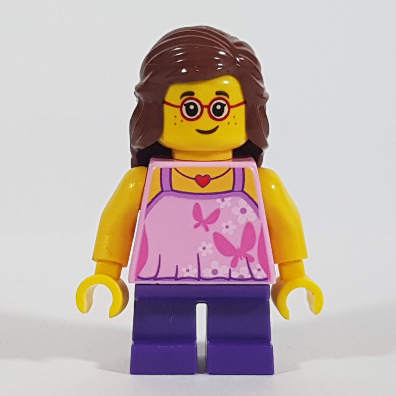 fig-009815 – Girl, Bright Pink Top with Butterflies, Dark Purple Legs, Reddish Brown Hair, Glasses