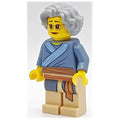 fig-009976 – Woman, Sand Blue Tunic, Light Bluish Gray Hair, Glasses