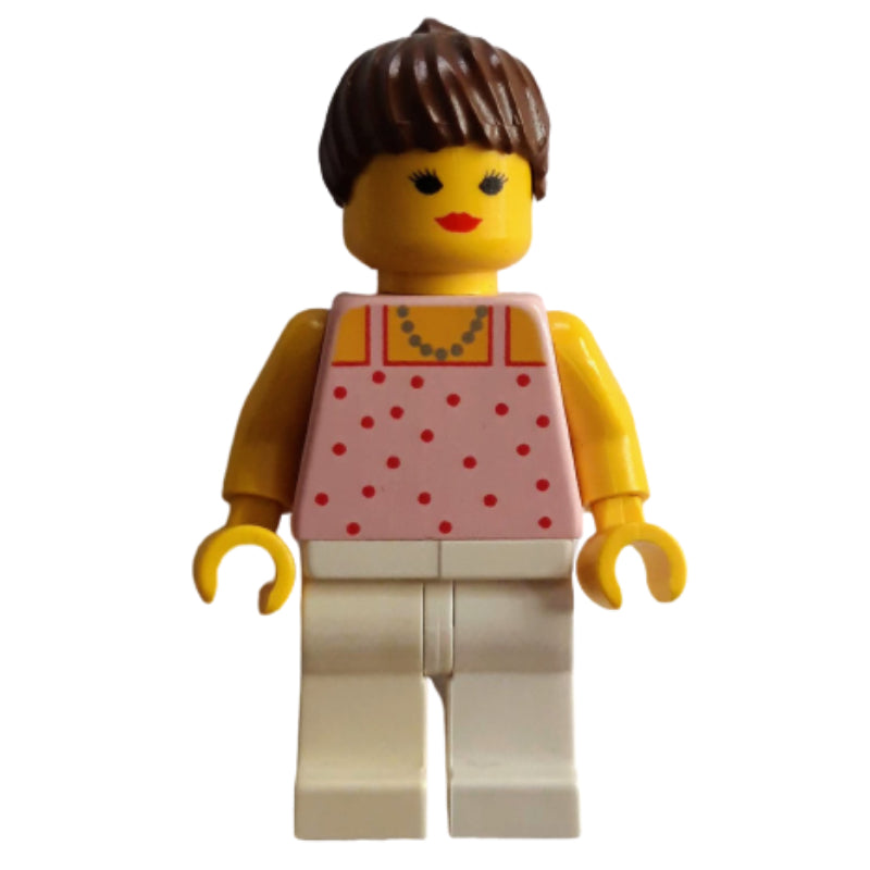 fig-010395 – Woman, Pink Top with Spots, White Legs, Brown Hair - Closed Mouth