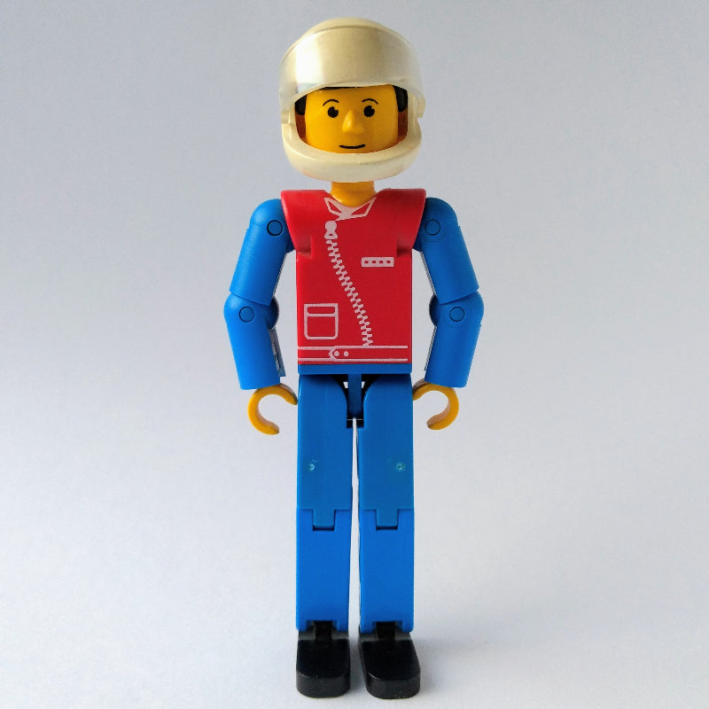 fig-010494 – Technic Figure Blue Legs, Red Top with Zip, Blue Arms, Black Hair - White Helmet
