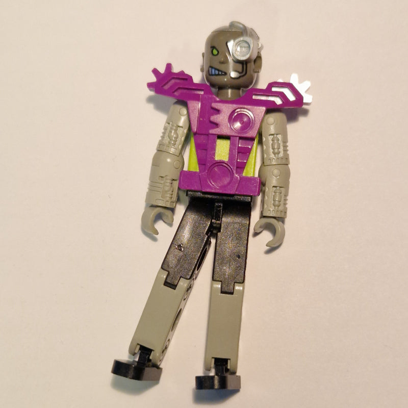 fig-010498 – Technic Figure Cyborg, Black Legs, Purple Armour, Mechanical Arms, Dark Gray Head, Cyborg Eyepiece - Purple Vest