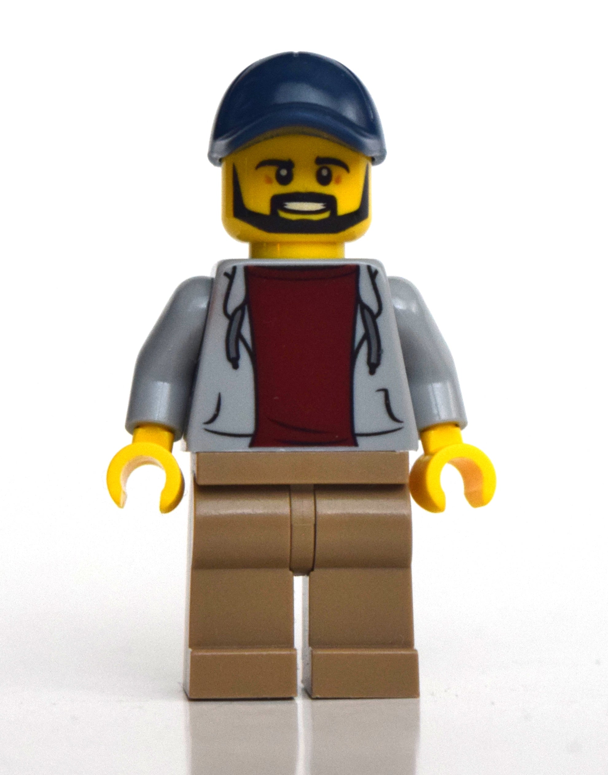 fig-010756 – Man, Light Bluish Gray Open Hoodie, Dark Tan Legs, Dark Blue Cap, Beard