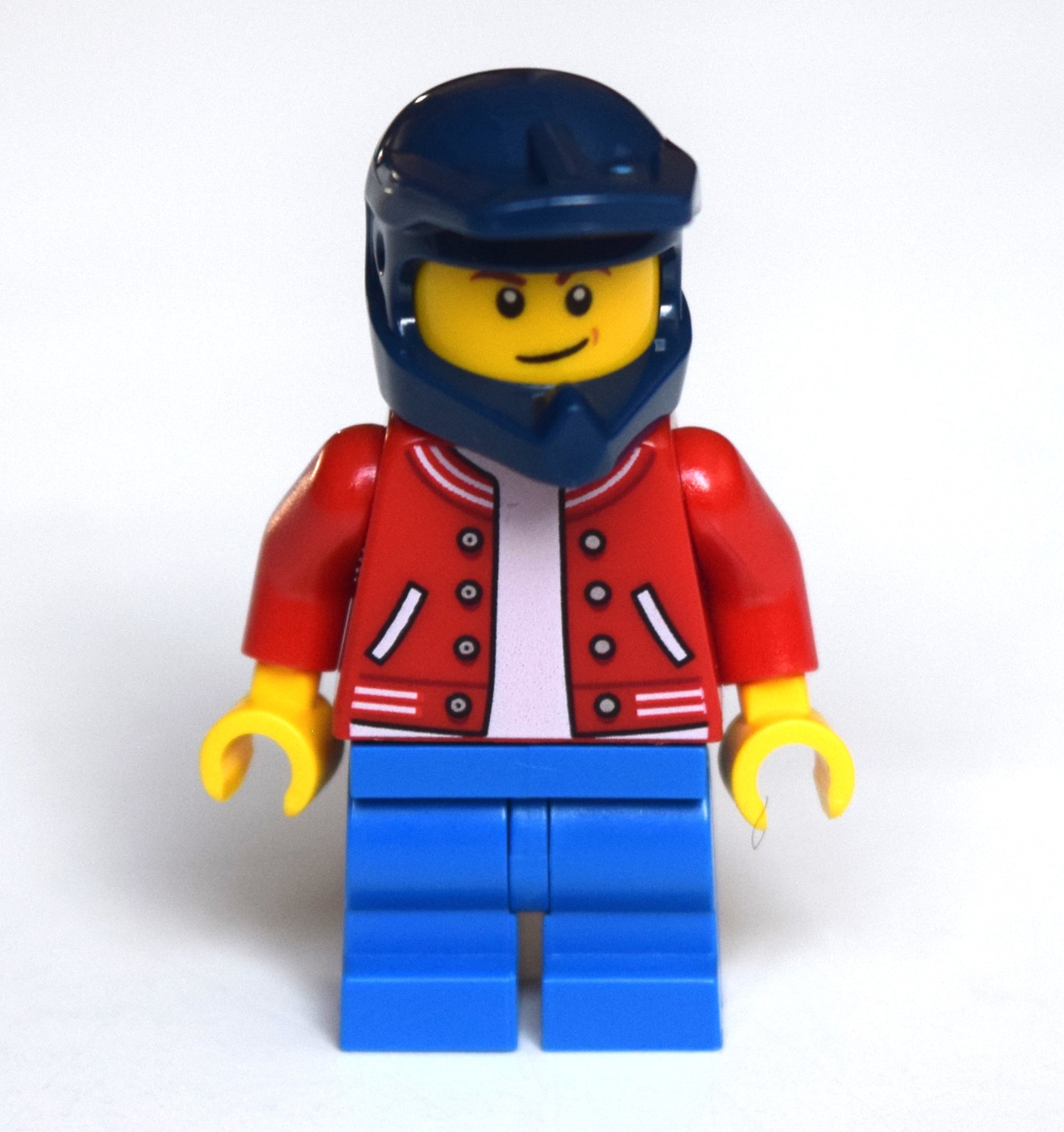 fig-010778 – Boy, Red Letterman Jacket, Blue Medium Legs, Dark Blue Dirt Bike Helmet