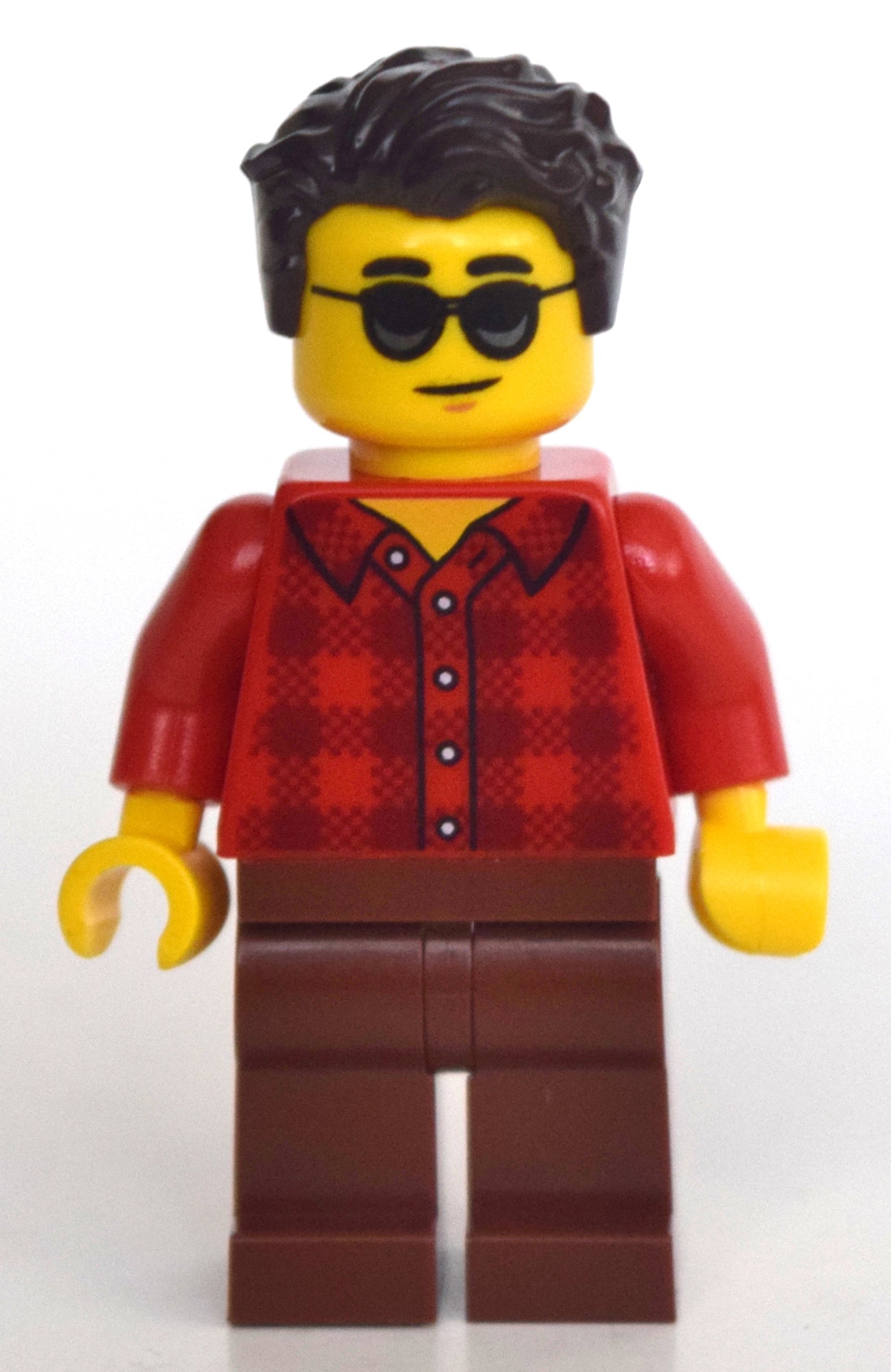 fig-010791 – Man, Red Plaid Shirt, Reddish Brown Legs, Sunglasses, Dark Brown Hair