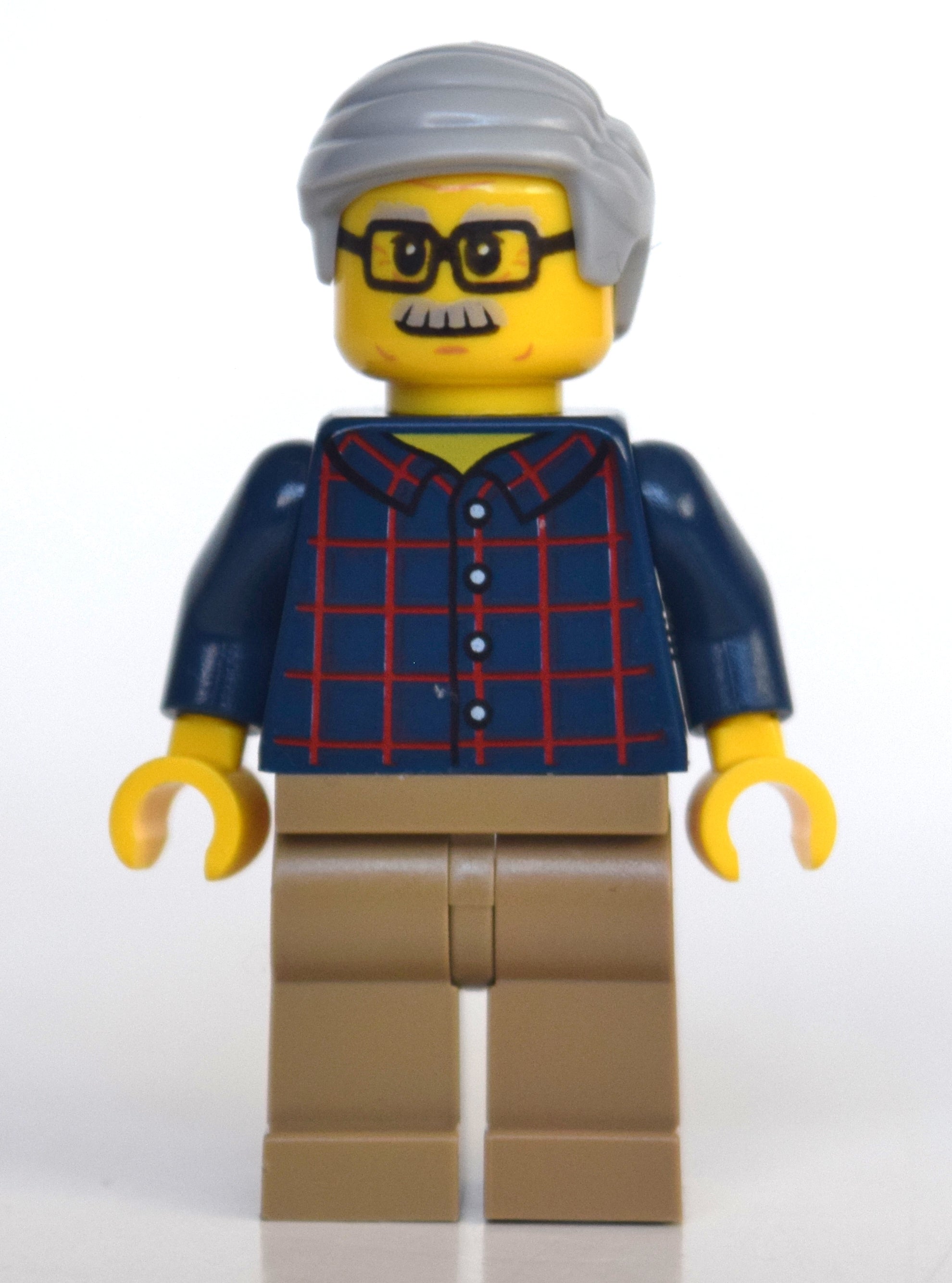 fig-010798 – Man, Dark Blue Plaid Shirt, Dark Tan Legs, Light Bluish Gray Hair and Moustache, Glasses