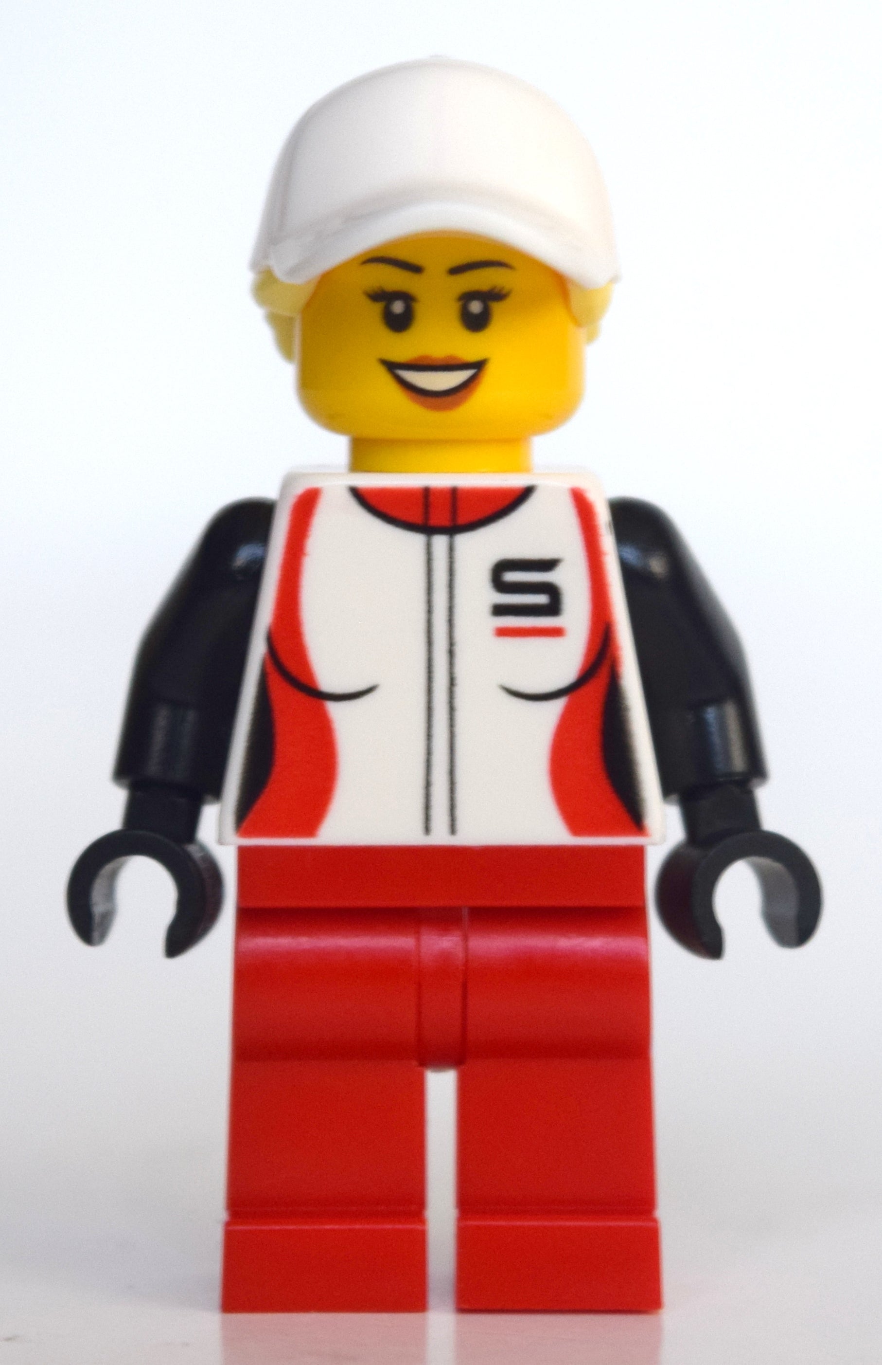 fig-010799 – Woman, Racing Jacket, Red Legs, Ponytail with White Cap