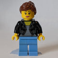 fig-010820 – Woman, Black Jacket, Medium Blue Legs, Reddish Brown Hair