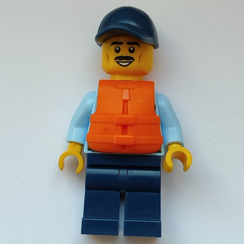 fig-010852 – Policeman, Bright Light Blue Shirt with Tie and Police Badge, Dark Blue Cap, Moustache