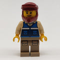 fig-011422 – Man, Blue Vest, Dark Red Dirt Bike Helmet, Stubble Beard