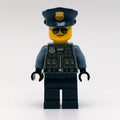 fig-011772 – Police Officer, Sand Blue Torso, Dark Blue Legs