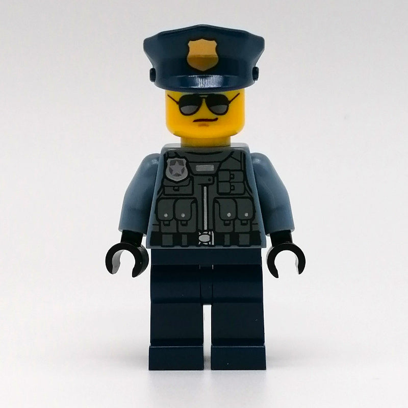 fig-011772 – Police Officer, Sand Blue Torso, Dark Blue Legs